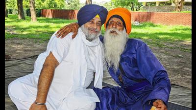 Shiromani Akali Dal president Sukhbir Singh Badal with Baba Labh Singh at Matka Chowk in Chandigarh. (PTI)