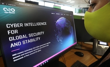 A woman checks the website of Israel-made Pegasus spyware at an office in the Cypriot capital Nicosia. (AFP) A woman checks the website of Israel-made Pegasus spyware at an office in the Cypriot capital Nicosia. (AFP)