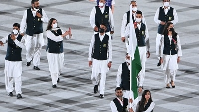 Pakistan's flag bearer Mahoor Shahzad and Pakistan's flag bearer Muhammad Khalil Akhtar lead the delegation during the opening ceremony of the Tokyo 2020 Olympic Games, at the Olympic Stadium, in Tokyo, (AFP) Pakistan's flag bearer Mahoor Shahzad and Pakistan's flag bearer Muhammad Khalil Akhtar lead the delegation during the opening ceremony of the Tokyo 2020 Olympic Games, at the Olympic Stadium, in Tokyo, (AFP)