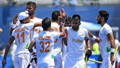 India's Harmanpreet Singh (C, partially covered) celebrates with teammates after scoring against New Zealand during their men's pool A match of the Tokyo 2020 Olympic Games field hockey competition, at the Oi Hockey Stadium in Tokyo on July 24, 2021. (Photo by Ina Fassbender / AFP) (AFP) India's Harmanpreet Singh (C, partially covered) celebrates with teammates after scoring against New Zealand during their men's pool A match of the Tokyo 2020 Olympic Games field hockey competition, at the Oi Hockey Stadium in Tokyo on July 24, 2021. (Photo by Ina Fassbender / AFP) (AFP)
