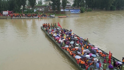 The death toll rose to 58 after record rains hit the major city of Zhengzhou on Tuesday, state TV reported. (AP) The death toll rose to 58 after record rains hit the major city of Zhengzhou on Tuesday, state TV reported. (AP)