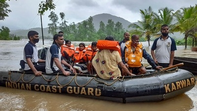 Indian Coast Guard (ICG) officers and Karnataka disaster response team during a rescue operation at a flooded area after heavy rain in Uttara Kannada district. (Via @IndiaCoastGuard on Twitter) Indian Coast Guard (ICG) officers and Karnataka disaster response team during a rescue operation at a flooded area after heavy rain in Uttara Kannada district. (Via @IndiaCoastGuard on Twitter)