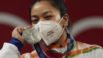 India's Mirabai Chanu poses with her silver medal at the Summer Olympics 2020 (PTI) India's Mirabai Chanu poses with her silver medal at the Summer Olympics 2020 (PTI)