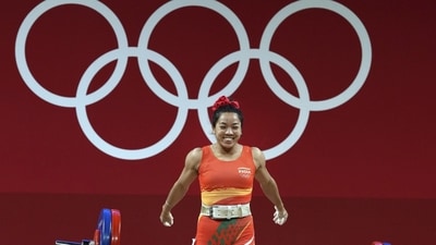 Mirabai Chanu reacts after a successful attempt in the 49 kg category of Women's Weightlifting event of the Summer Olympics 2020, in Tokyo. (PTI Photo) Mirabai Chanu reacts after a successful attempt in the 49 kg category of Women's Weightlifting event of the Summer Olympics 2020, in Tokyo. (PTI Photo)