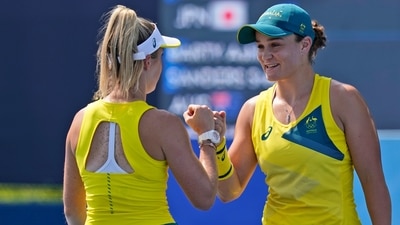 Ashleigh Barty, right, and Storm Sanders, both of Australia, play in a doubles match during the first round of the tennis competition at the 2020 Summer Olympics, Saturday, July 24, 2021, in Tokyo, Japan. (AP Photo/Seth Wenig) (AP) Ashleigh Barty, right, and Storm Sanders, both of Australia, play in a doubles match during the first round of the tennis competition at the 2020 Summer Olympics, Saturday, July 24, 2021, in Tokyo, Japan. (AP Photo/Seth Wenig) (AP)