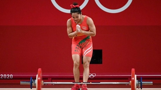 Weightlifter Mirabai Chanu during the Women's 49kg category weightlifting attempt as she wins a silver medal at Tokyo Olympics 2020, in Tokyo on Saturday.(ANI Photo)