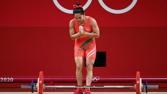 Weightlifter Mirabai Chanu during the Women's 49kg category weightlifting attempt as she wins a silver medal at Tokyo Olympics 2020, in Tokyo on Saturday.(ANI Photo)