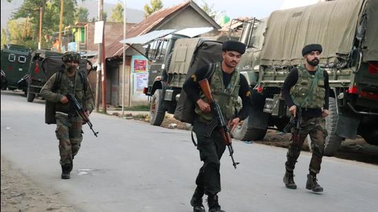 Indian security forces personnel during an encounter with militants in Warpora area of Sopore in north Kashmir’s Baramulla district on Friday. (PTI)