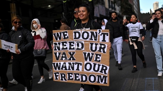 Most of the anti-lockdown protestors were seen walking maskless and were carrying signboards with slogans like "Wake up Australia" and "Drain the Swamp".. (Photo by Steven SAPHORE / AFP)(AFP)