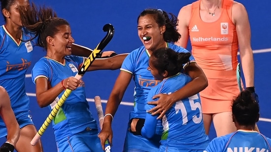 India's Rani (C) celebrates with teammates after scoring against Netherlands during their women's pool A match of the Tokyo 2020 Olympic Games field hockey competition, at the Oi Hockey Stadium in Tokyo on July 24, 2021. (Photo by Ina Fassbender / AFP)(AFP)