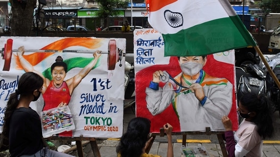 Students celebrate weightlifter Mirabai Chanu's silver medal win at the Tokyo Games, in Mumbai, Saturday, July 24, 2021.(PTI)