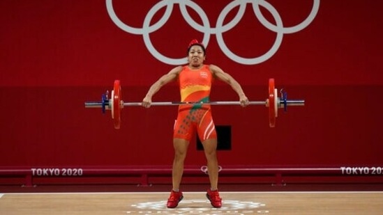 Mirabai Chanu Saikhom of India competes in the women's 49kg weightlifting event, at the 2020 Summer Olympics, Saturday, July 24, 2021, in Tokyo, Japan. (AP Photo/Luca Bruno)(AP)