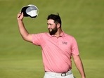 Spain's Jon Rahm acknowledges the crowd on the 18th green after completing his final round REUTERS/Rebecca Naden
