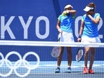 Ankita Raina and Sania Mirza react during their first-round match against Lyudmyla Kichenok and Nadiia Kichenok.