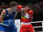Manish Kaushik of India in action against Luke McCormack of Britain
