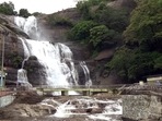 Courtallam waterfall in Tenkasi witnesses heavy footfall after heavy rains enhanced the natural beauty of the tourist spot. (PTI) Courtallam waterfall in Tenkasi witnesses heavy footfall after heavy rains enhanced the natural beauty of the tourist spot. (PTI)