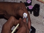 A micro artist from Santinagar area in West Bengal's Siliguri painted his nail with a symbol of the Olympics to inspire the Indian athletes participating in the Tokyo Olympics.(ANI) A micro artist from Santinagar area in West Bengal's Siliguri painted his nail with a symbol of the Olympics to inspire the Indian athletes participating in the Tokyo Olympics.(ANI)