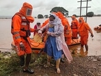 India's National Disaster Response Force (NDRF), shows NDRF personnel rescuing stranded villagers from flooded areas following heavy monsoon rains in Balinge village of Kolhapur district of Maharashtra. (AFP) India's National Disaster Response Force (NDRF), shows NDRF personnel rescuing stranded villagers from flooded areas following heavy monsoon rains in Balinge village of Kolhapur district of Maharashtra. (AFP)
