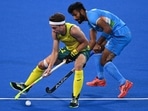 Australia's Flynn Andrew Ogilvie (L) and India's Surender Kumar vie for the ball during their men's pool A match of the Tokyo 2020 Olympic Games(AFP) Australia's Flynn Andrew Ogilvie (L) and India's Surender Kumar vie for the ball during their men's pool A match of the Tokyo 2020 Olympic Games(AFP)