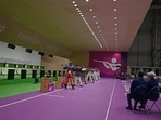 Officials watch the men's 10m air rifle final during the Tokyo 2020 Olympic Games