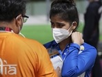India's Manu Bhaker with Coach Ronak Pandit (L) reacts after the 10m Air Pistol Women's Qualification at the Summer Olympics 2020.