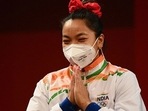 Silver medallist India's Mirabai Chanu gestures on the podium. Silver medallist India's Mirabai Chanu gestures on the podium.