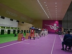 Officials watch the men's 10m air rifle final during the Tokyo 2020 Olympic Games. 