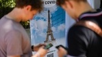FILE - In this Wednesday, July 21, 2021 file photo, visitors register for Covid-19 tests at the Eiffel Tower in Paris. For Europe’s battered tourism industry, fresh virus outbreaks and chaos and confusion over travel rules are contributing to a another cruel summer. With Covid-19 variants surging in parts of Europe, popular destination countries are taking measures to contain outbreaks. In France, the world's most visited country, visitors to cultural and tourist sites were confronted Wednesday, July 21, 2021 with a new requirement for a special Covid-19 pass. To get it, people must prove they're either fully vaccinated or recently recovered from an infection, or produce a negative virus test.(AP Photo/Daniel Cole, File) FILE - In this Wednesday, July 21, 2021 file photo, visitors register for Covid-19 tests at the Eiffel Tower in Paris. For Europe’s battered tourism industry, fresh virus outbreaks and chaos and confusion over travel rules are contributing to a another cruel summer. With Covid-19 variants surging in parts of Europe, popular destination countries are taking measures to contain outbreaks. In France, the world's most visited country, visitors to cultural and tourist sites were confronted Wednesday, July 21, 2021 with a new requirement for a special Covid-19 pass. To get it, people must prove they're either fully vaccinated or recently recovered from an infection, or produce a negative virus test.(AP Photo/Daniel Cole, File)