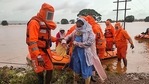 India's National Disaster Response Force (NDRF), shows NDRF personnel rescuing stranded villagers from flooded areas following heavy monsoon rains in Balinge village of Kolhapur district of Maharashtra. (AFP) India's National Disaster Response Force (NDRF), shows NDRF personnel rescuing stranded villagers from flooded areas following heavy monsoon rains in Balinge village of Kolhapur district of Maharashtra. (AFP)