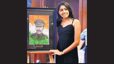 Aparajita with a picture of her father Maj Padmapani Acharya Aparajita with a picture of her father Maj Padmapani Acharya