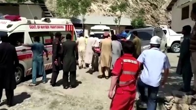 People wheel a gurney towards an ambulance outside a hospital in Dasu, after a bus with Chinese nationals on board plunged into a ravine in Upper Kohistan following a blast, Pakistan. (REUTERS) People wheel a gurney towards an ambulance outside a hospital in Dasu, after a bus with Chinese nationals on board plunged into a ravine in Upper Kohistan following a blast, Pakistan. (REUTERS)