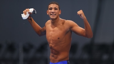 Ahmed Hafnaoui of Tunisia celebrates after winning. (REUTERS)