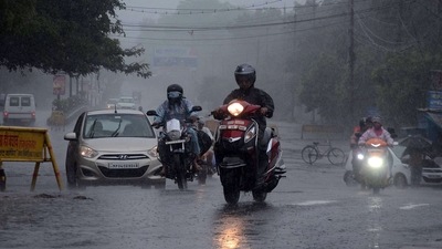 REPRESENTATIONAL IMAGE: Commuters travel amid heavy rainfall, in Bhopal on Friday. (ANI)