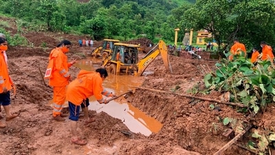 National Disaster Response Force (NDRF) women personnel engaged in rescue work at a landslide spot at Ratnagiri in Maharashtra on July 24. (AP) National Disaster Response Force (NDRF) women personnel engaged in rescue work at a landslide spot at Ratnagiri in Maharashtra on July 24. (AP)
