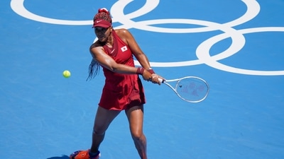 Naomi Osaka, of Japan, returns to China's Zheng Saisai during the tennis competition at the 2020 Summer Olympics. (AP) Naomi Osaka, of Japan, returns to China's Zheng Saisai during the tennis competition at the 2020 Summer Olympics. (AP)