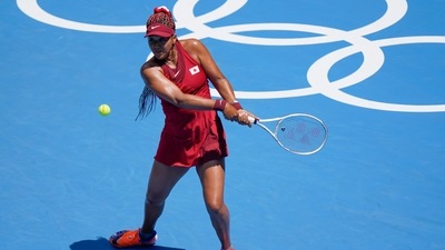 Naomi Osaka, of Japan, returns to China's Zheng Saisai during the tennis competition at the 2020 Summer Olympics. (AP) Naomi Osaka, of Japan, returns to China's Zheng Saisai during the tennis competition at the 2020 Summer Olympics. (AP)