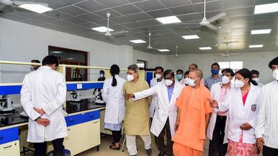 Uttar Pradesh chief minister Yogi Adityanath inspects Dashrath Medical College in Ayodhya on Sunday. (PTI PHOTO)