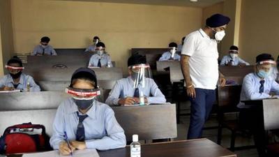 Students have been asked to wear a mask and sanitise their hands over zoom meetings held to discuss protocol. (HT file photo)