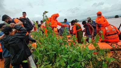 Two teams of Brihanmumbai Municipal Corporation (BMC) arrived at Raigad and Kolhapur to carry rescue operations in the areas. Meanwhile, National Disaster Response Force (NDRF) deployed 8 more teams in the flood-affected areas. A total of 34 teams have been deployed for rescue and relief work at various places. (AP) Two teams of Brihanmumbai Municipal Corporation (BMC) arrived at Raigad and Kolhapur to carry rescue operations in the areas. Meanwhile, National Disaster Response Force (NDRF) deployed 8 more teams in the flood-affected areas. A total of 34 teams have been deployed for rescue and relief work at various places. (AP)