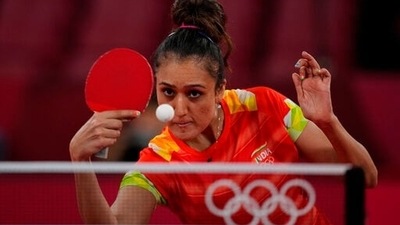 India's Manika Batra competes during the table tennis women's singles first round match against Britain's Ho Tin Tin at the 2020 Summer Olympics, Saturday, July 24, 2021, in Tokyo. (AP Photo/Kin Cheung) (AP) India's Manika Batra competes during the table tennis women's singles first round match against Britain's Ho Tin Tin at the 2020 Summer Olympics, Saturday, July 24, 2021, in Tokyo. (AP Photo/Kin Cheung) (AP)