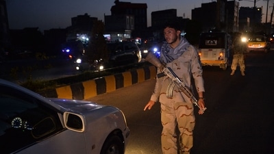 A security personnel stops a vehcile at a check point in Herat. (AFP)