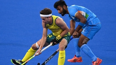 Australia's Flynn Andrew Ogilvie (L) and India's Surender Kumar vie for the ball during their men's pool A match of the Tokyo 2020 Olympic Games (AFP) Australia's Flynn Andrew Ogilvie (L) and India's Surender Kumar vie for the ball during their men's pool A match of the Tokyo 2020 Olympic Games (AFP)