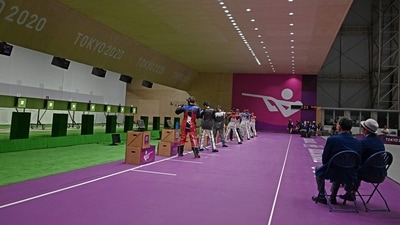 Officials watch the men's 10m air rifle final during the Tokyo 2020 Olympic Games (AFP) Officials watch the men's 10m air rifle final during the Tokyo 2020 Olympic Games (AFP)