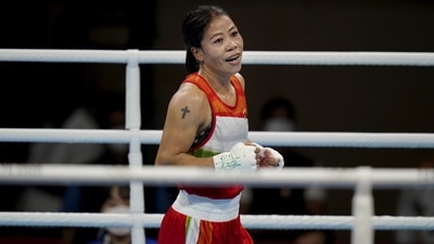 Tokyo: Indian boxer Mary Kom in action with Miguelina Hernandez Garcia of the Dominican Republic, during their women's flyweight 51-kg boxing match at the 2020 Summer Olympics, Sunday, July 25, 2021, in Tokyo, Japan. (PTI Photo)(PTI07_25_2021_000101B) (PTI) Tokyo: Indian boxer Mary Kom in action with Miguelina Hernandez Garcia of the Dominican Republic, during their women's flyweight 51-kg boxing match at the 2020 Summer Olympics, Sunday, July 25, 2021, in Tokyo, Japan. (PTI Photo)(PTI07_25_2021_000101B) (PTI)