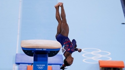 Simone Biles, of the United States, performs on the vault during the women's artistic gymnastic qualifications at the 2020 Summer Olympics, Sunday, July 25, 2021, in Tokyo. (AP Photo/Gregory Bull) (AP) Simone Biles, of the United States, performs on the vault during the women's artistic gymnastic qualifications at the 2020 Summer Olympics, Sunday, July 25, 2021, in Tokyo. (AP Photo/Gregory Bull) (AP)