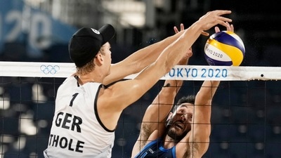Palo Nicolai, right, of Italy, battles at the net with Julius Thole, of Germany, during a men's beach volleyball match at the 2020 Summer Olympics, Sunday, July 25, 2021, in Tokyo, Japan. (AP Photo/Felipe Dana) (AP) Palo Nicolai, right, of Italy, battles at the net with Julius Thole, of Germany, during a men's beach volleyball match at the 2020 Summer Olympics, Sunday, July 25, 2021, in Tokyo, Japan. (AP Photo/Felipe Dana) (AP)