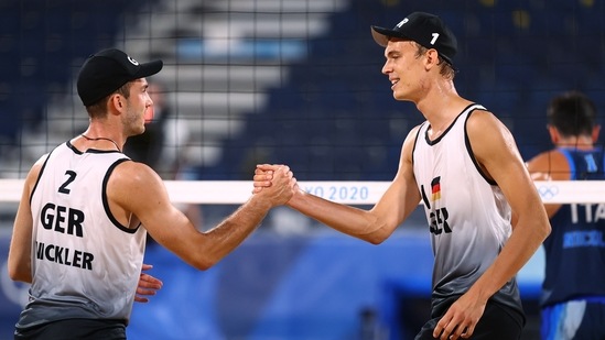 Tokyo 2020 Olympics - Beach Volleyball - Men - Pool F - Germany (Thole J/Wickler) v Italy (Nicolai/Lupo) - Shiokaze Park, Tokyo, Japan - July 25, 2021. Julius Thole of Germany and Clemens Wickler of Germany during the match. REUTERS/Pilar Olivares(REUTERS)