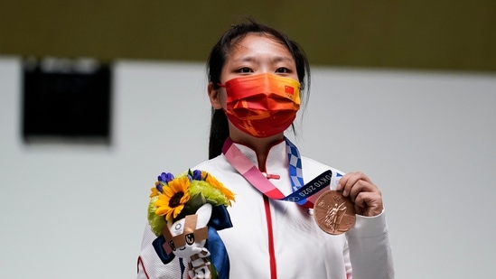 Jiang Ranxin, of China, holds her bronze medal for the women's 10-meter air pistol at the Asaka Shooting Range in the 2020 Summer Olympics, Sunday, July 25, 2021, in Tokyo, Japan. (AP Photo/Alex Brandon)(AP)