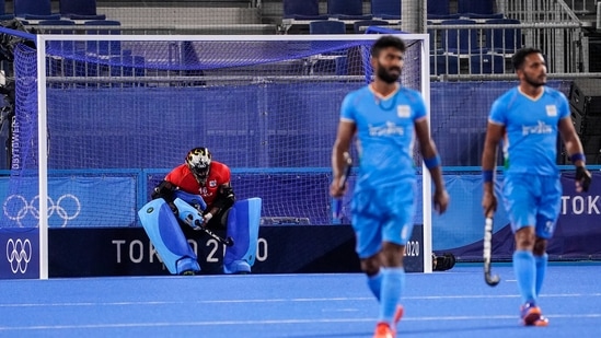 India goalkeeper Sreejesh Parattu Raveendran sits in his goal after giving up seven goals to Australia during a men's field hockey match at the 2020 Summer Olympics, Sunday, July 25, 2021, in Tokyo, Japan. (AP Photo/John Minchillo)(AP)