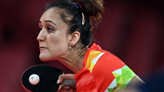India's Manika Batra hits a shot against Britain's Tin-Tin Ho during their women's singles round 1 table tennis match at the Tokyo Metropolitan Gymnasium during the Tokyo 2020 Olympic Games in Tokyo on July 24, 2021. (Photo by JUNG Yeon-je / AFP)(AFP)